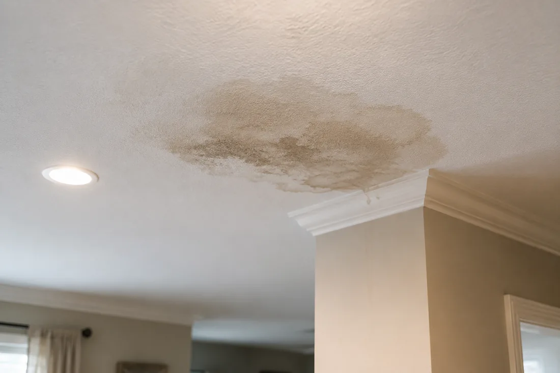 Water-stained interior ceiling from a roof leak